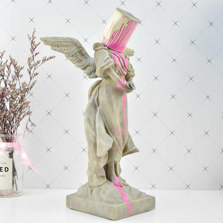 Bansky Paint on Angel - EveryEssential
